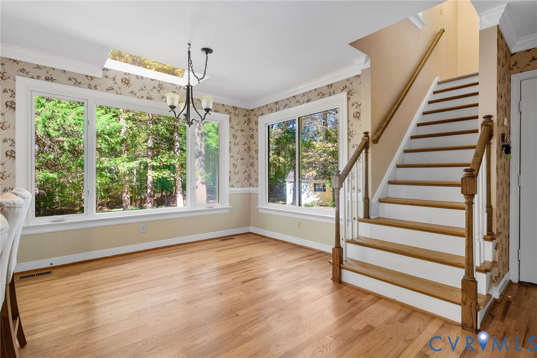 15010 Walnut Bend Road Midlothian, VA 23112 - Photo 13 of 35 a view of a room with wooden floor and windows
