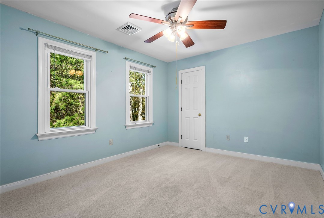 15010 Walnut Bend Road Midlothian, VA 23112 - Photo 25 of 35 an empty room with windows and fan
