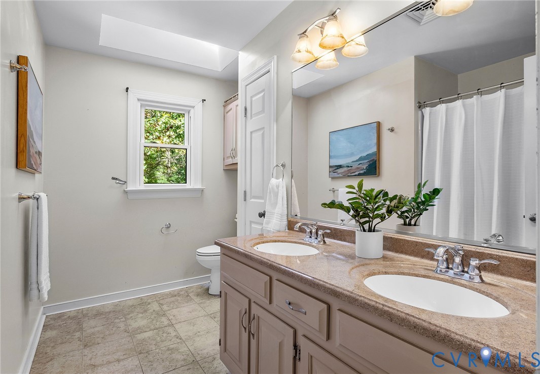 15010 Walnut Bend Road Midlothian, VA 23112 - Photo 30 of 35 a bathroom with a granite countertop sink and a mirror