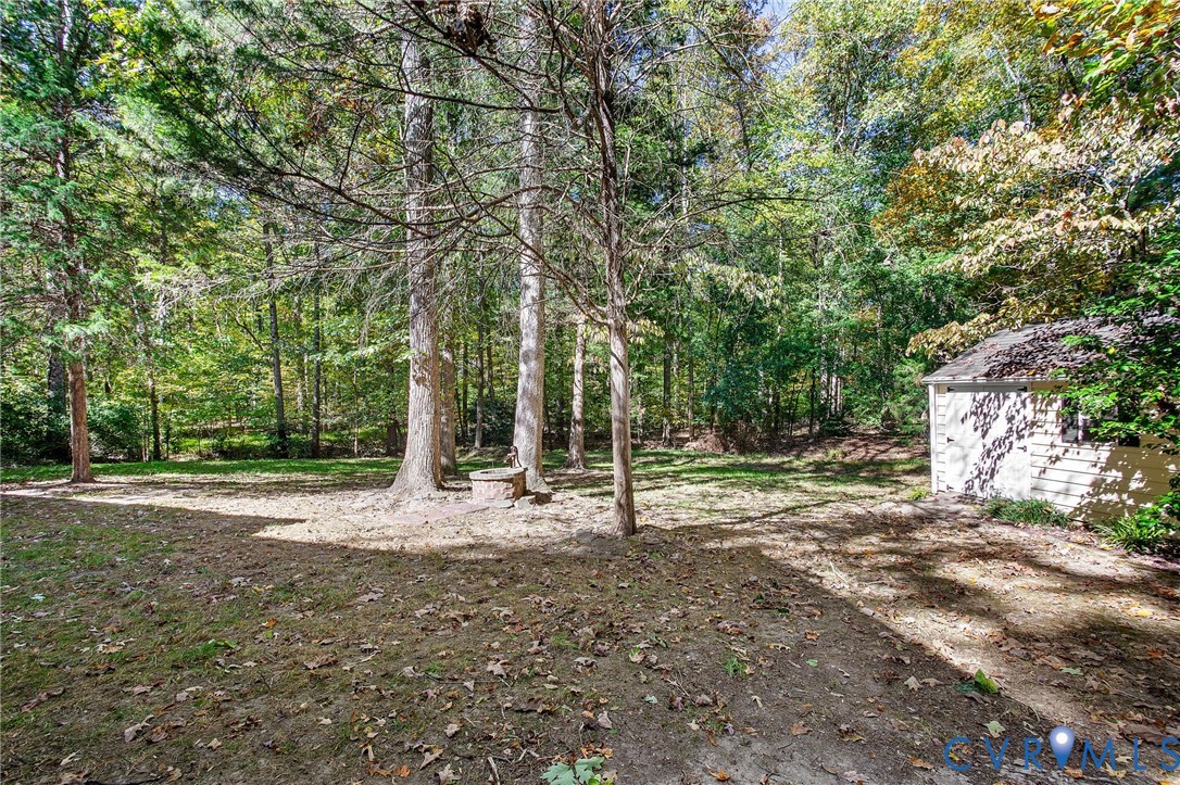 15010 Walnut Bend Road Midlothian, VA 23112 - Photo 32 of 35 a backyard of a house with lots of green space