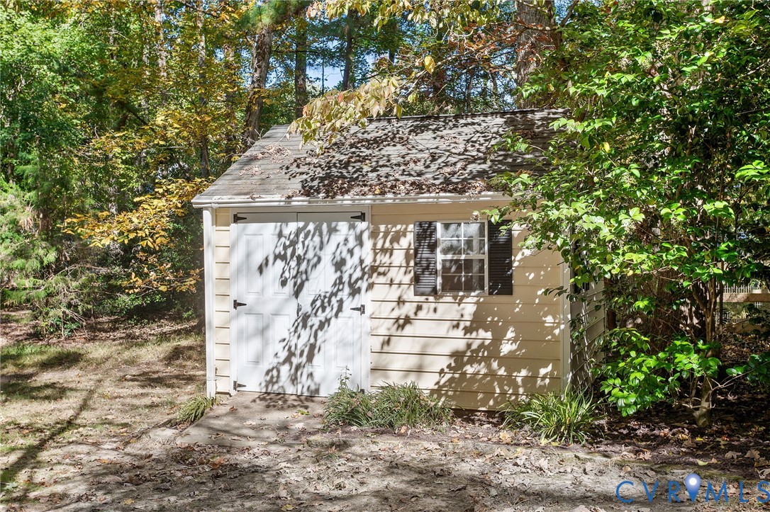 15010 Walnut Bend Road Midlothian, VA 23112 - Photo 34 of 35 a front view of a house with a tree