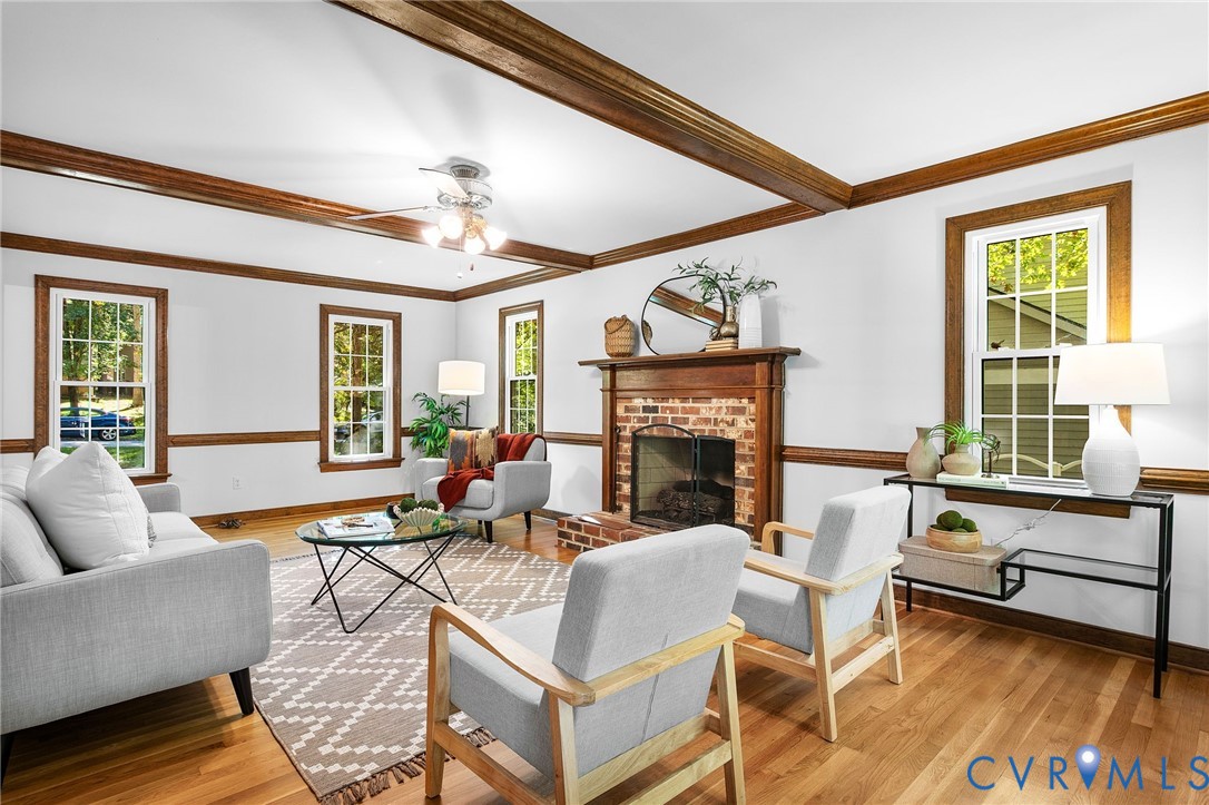 15010 Walnut Bend Road Midlothian, VA 23112 - Photo 7 of 35 a living room with fireplace furniture and a large window