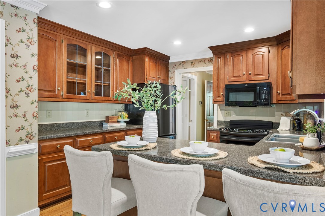 15010 Walnut Bend Road Midlothian, VA 23112 - Photo 10 of 35 a kitchen with stainless steel appliances granite countertop a refrigerator and a stove top oven