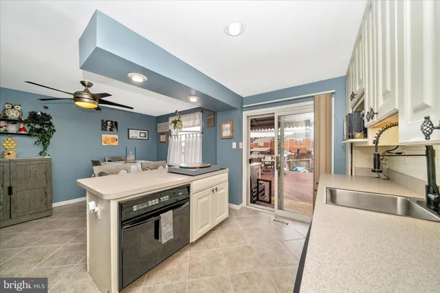 a kitchen with a stove and a refrigerator