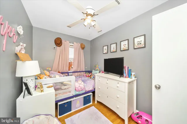 a room with a bed and a flat screen tv