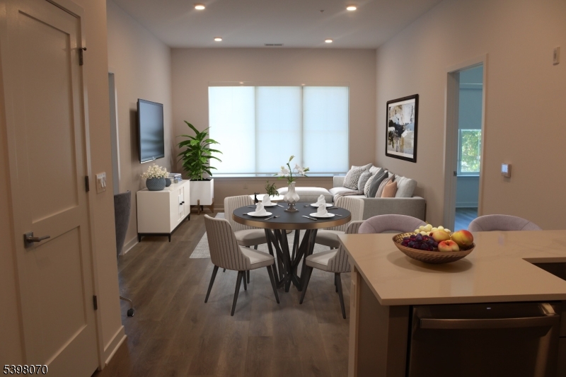 2 River Road, Unit 306 Chatham, NJ 07928 - Photo 4 of 13 a dining room with furniture and window