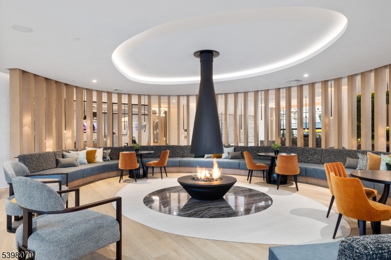 2 River Road, Unit 306 Chatham, NJ 07928 - Photo 8 of 13 a living room with furniture and large windows