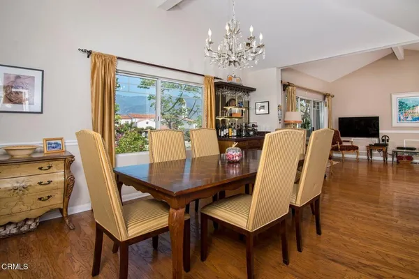 a view of a dining room with furniture window and wooden floor
