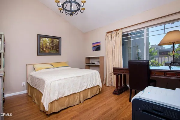 a bedroom with a bed and a table in it