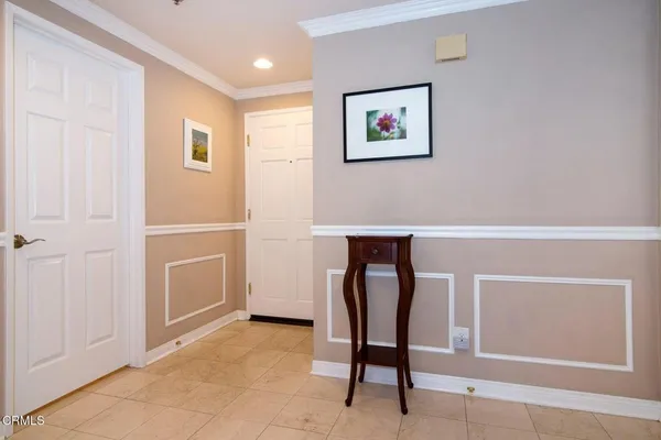 a view of cabinets with furniture and wooden floor