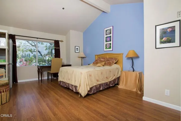 a bedroom with a bed and a table