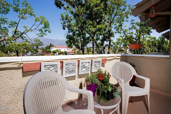 a view from deck having patio