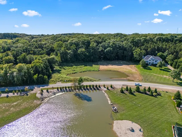 a view of a swimming pool with a yard