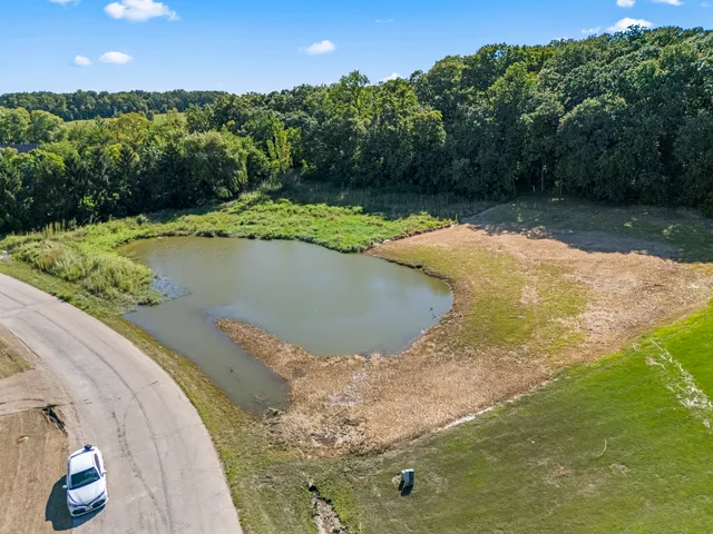 a view of a swimming pool with a yard