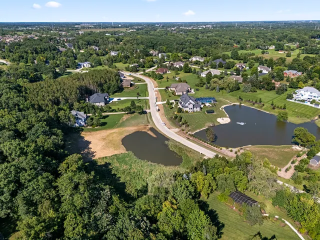 an aerial view of a house with yard