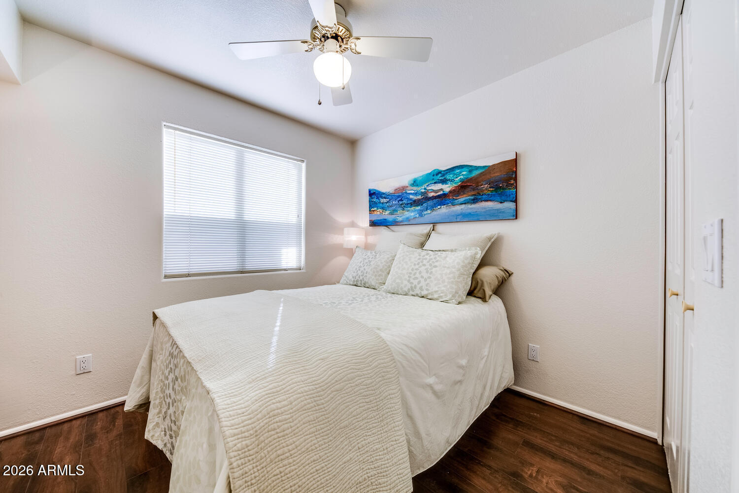 17200 West Bell Road, Unit 1260 Surprise, AZ 85374 - Photo 11 of 31 a bedroom with a bed and a window