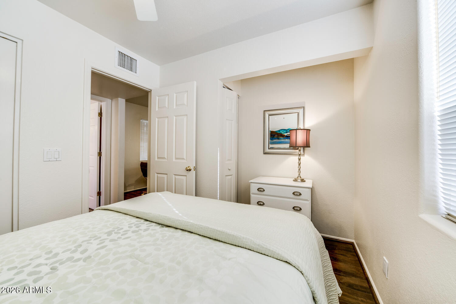 17200 West Bell Road, Unit 1260 Surprise, AZ 85374 - Photo 12 of 31 a bedroom with a bed and a window