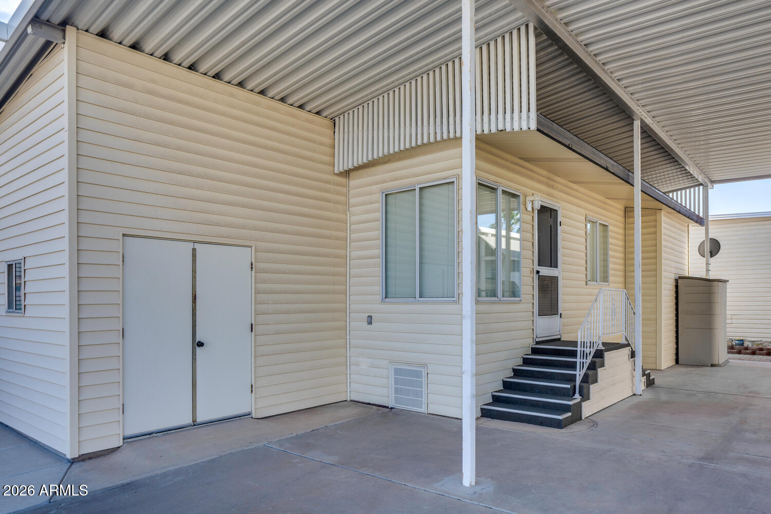 17200 West Bell Road, Unit 1260 Surprise, AZ 85374 - Photo 15 of 31 a view of a house with a door and wooden walls