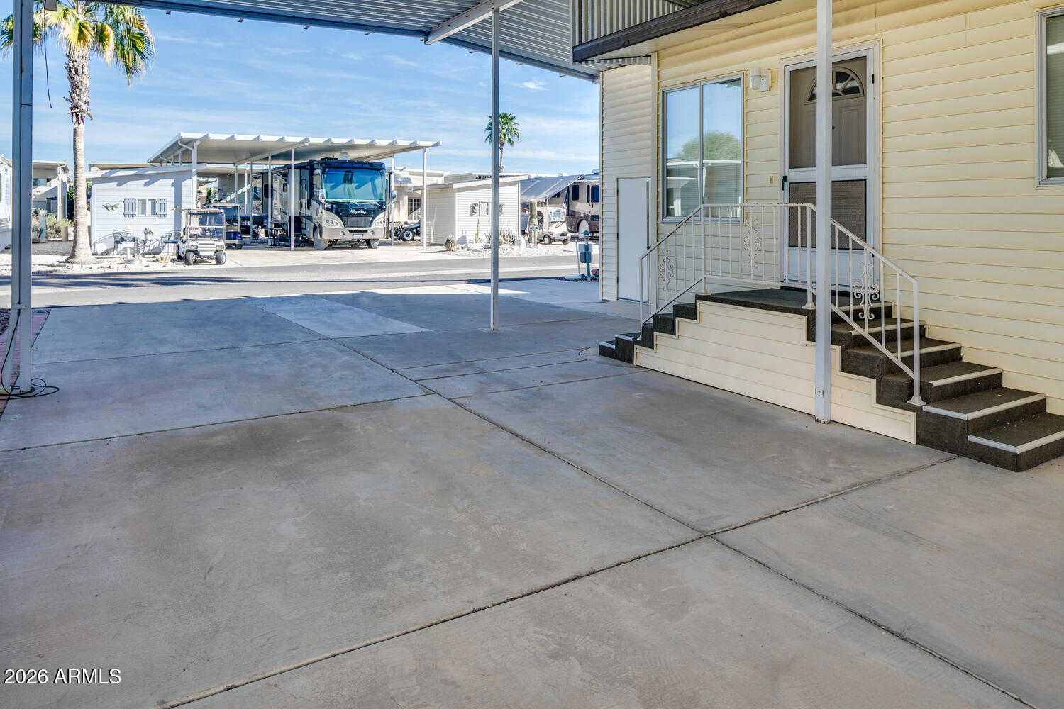 17200 West Bell Road, Unit 1260 Surprise, AZ 85374 - Photo 16 of 31 a view of a patio with table and chairs