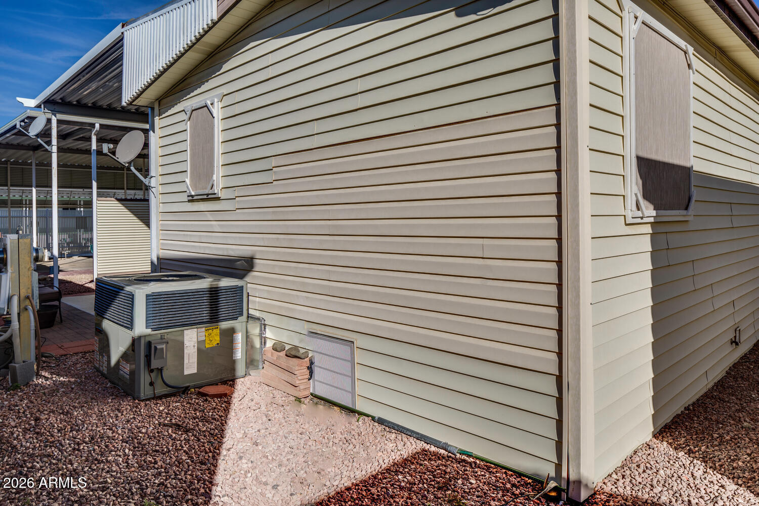 17200 West Bell Road, Unit 1260 Surprise, AZ 85374 - Photo 18 of 31 a view of a patio with table and chairs and wooden floor