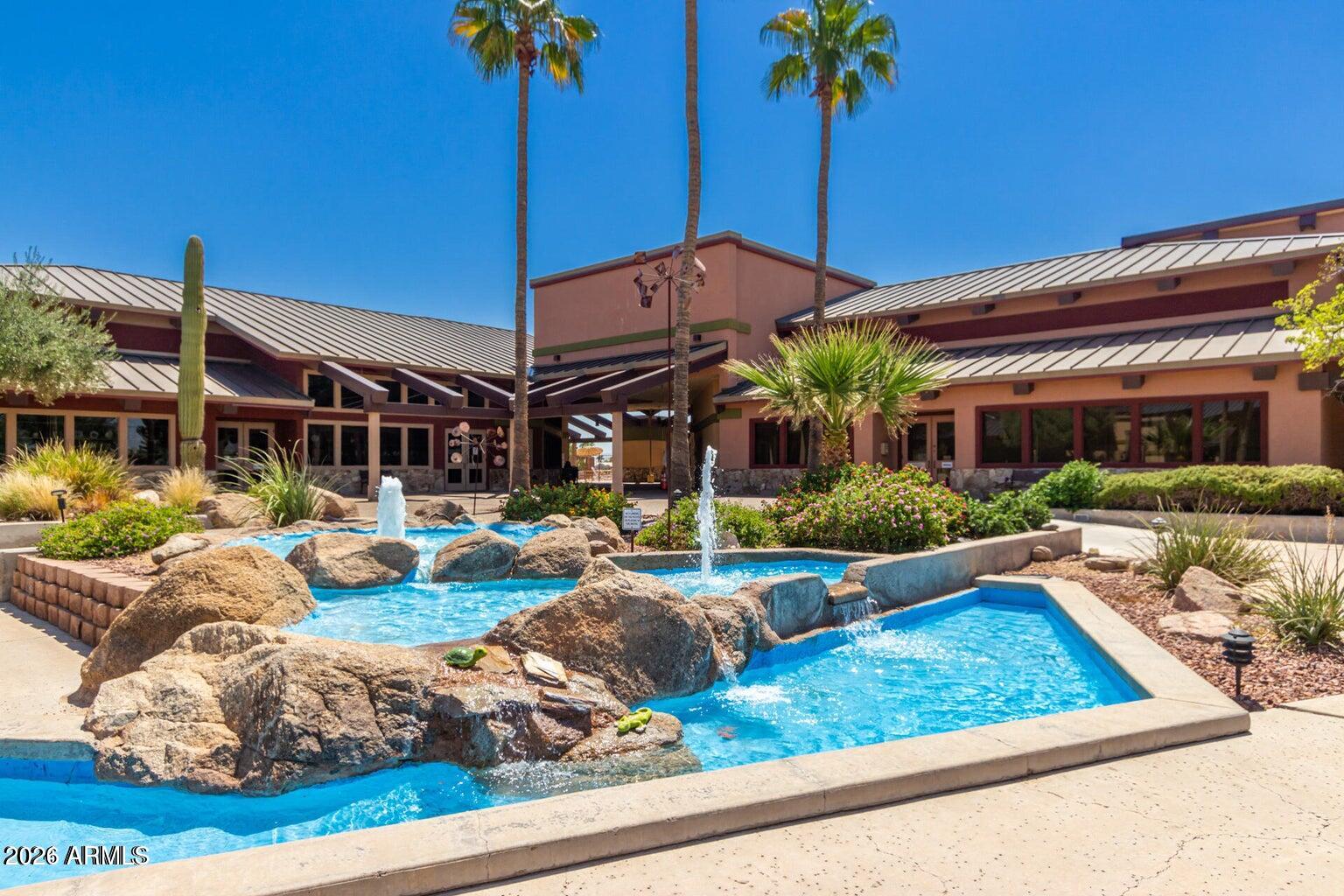 17200 West Bell Road, Unit 1260 Surprise, AZ 85374 - Photo 21 of 31 a view of a house with backyard porch and sitting area