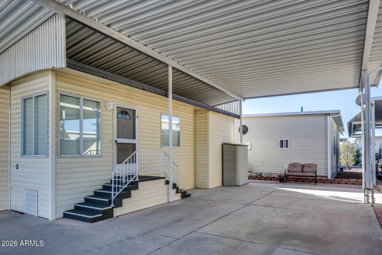 17200 West Bell Road, Unit 1260 Surprise, AZ 85374 - Photo 3 of 31 a view of a patio with table and chairs