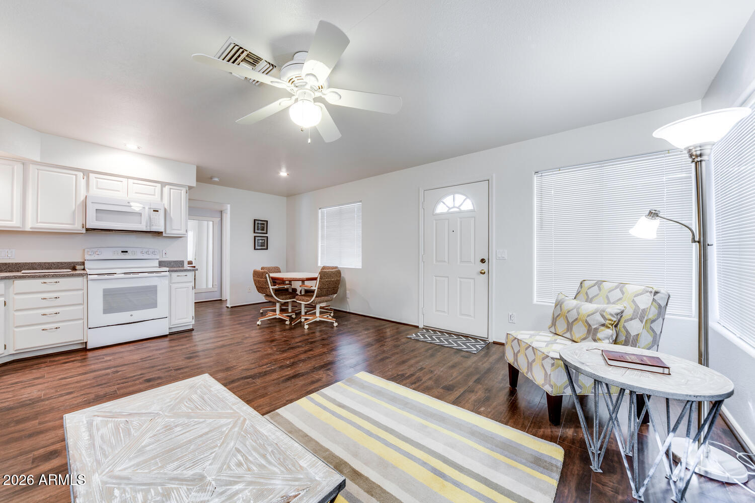 17200 West Bell Road, Unit 1260 Surprise, AZ 85374 - Photo 4 of 31 a living room with furniture and kitchen view