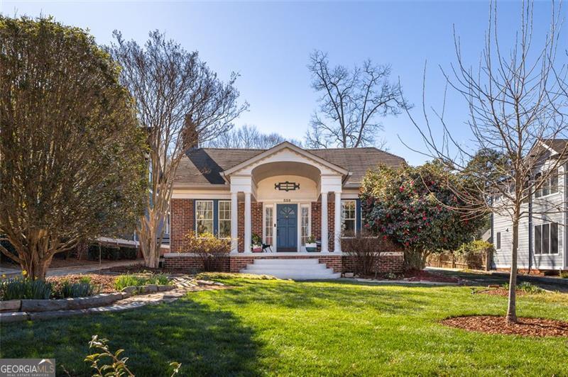 338 Hill Street Decatur, GA 30030 - Photo 1 of 1 a view of a house with a big yard and large trees