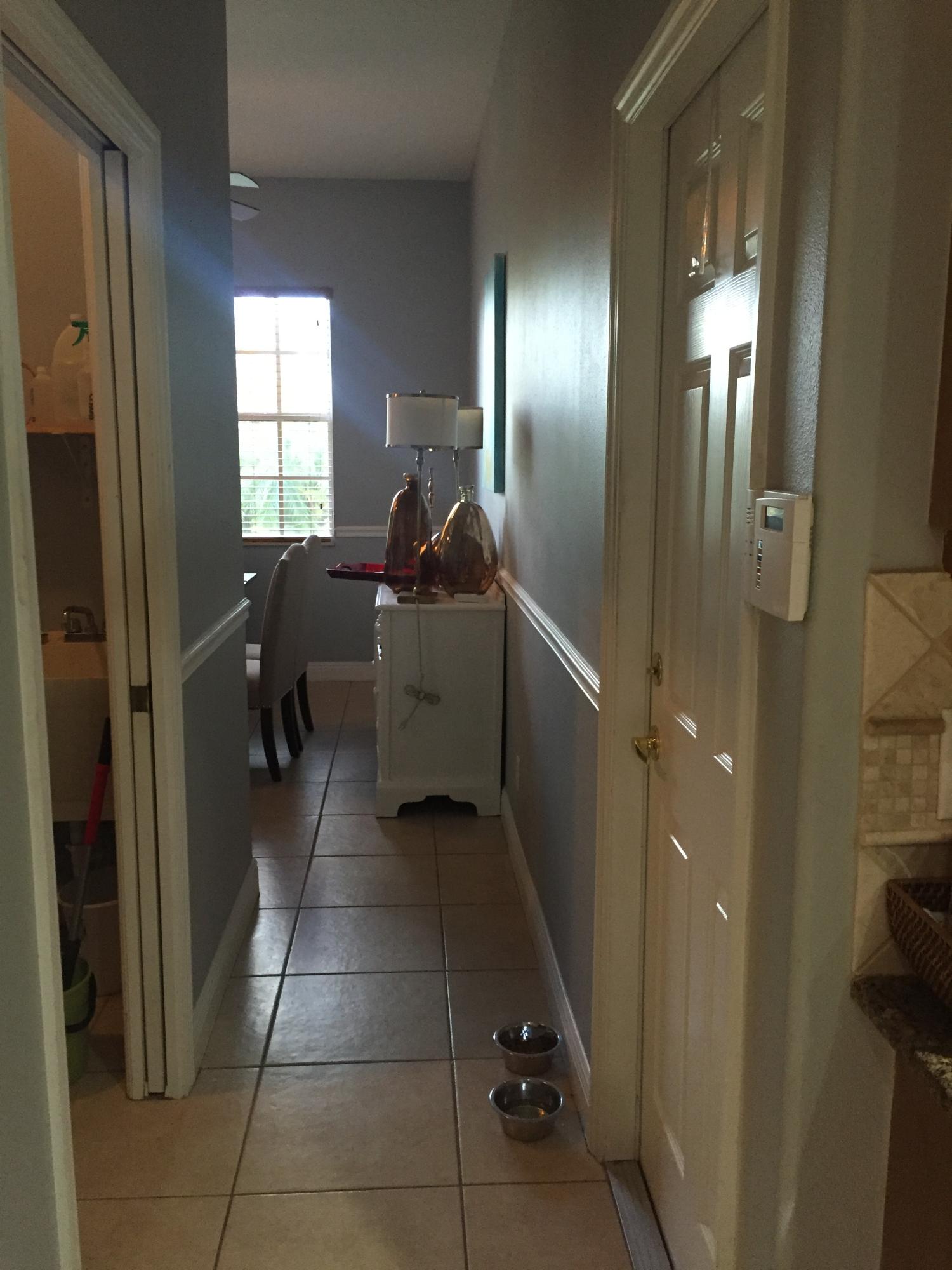 602 Southwest Dairy Road Port St. Lucie, FL 34953 - Photo 11 of 26 Hallway Garage Entry