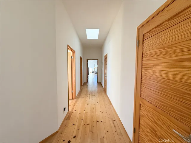 a living room with a fireplace and a wooden floor