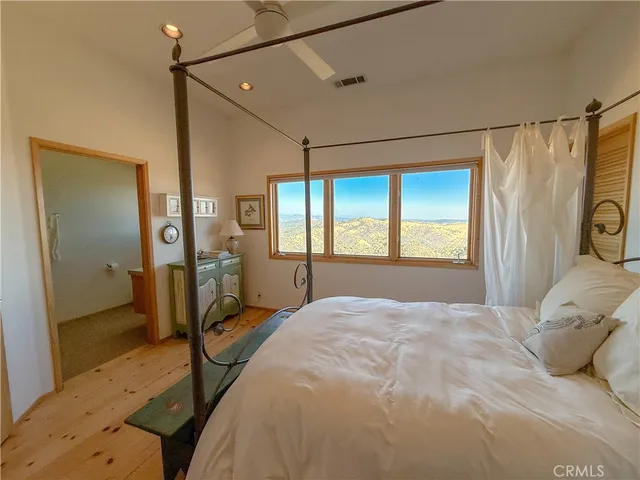 a bathroom with a toilet sink and shower curtain
