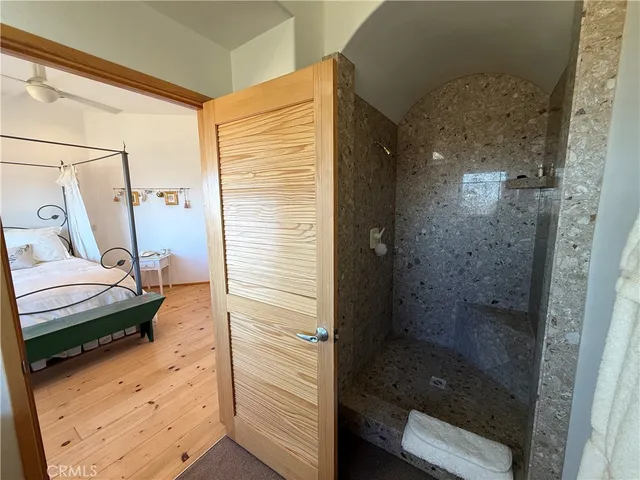 a bathroom with a sink toilet and mirror