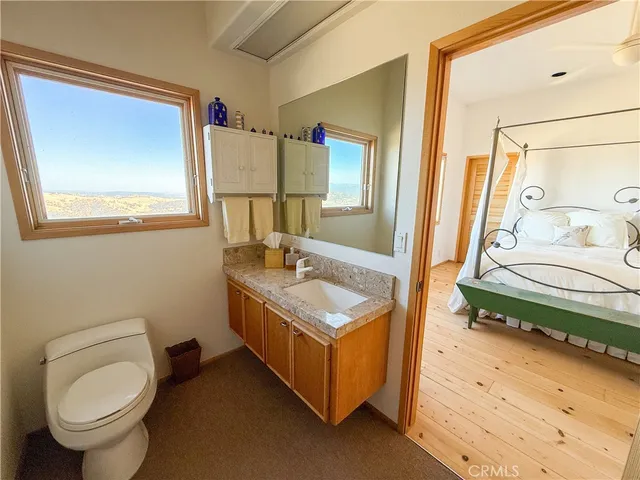 a room with furniture and a wooden floor