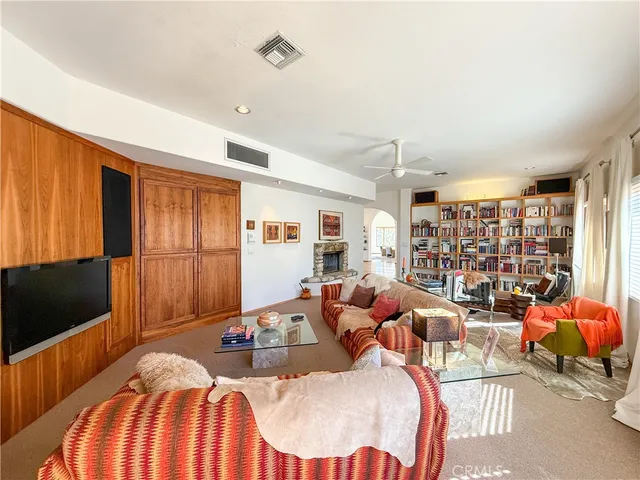 a view of entryway livingroom and hallway with wooden floor