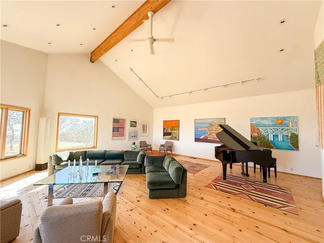 a view of a living room and kitchen view