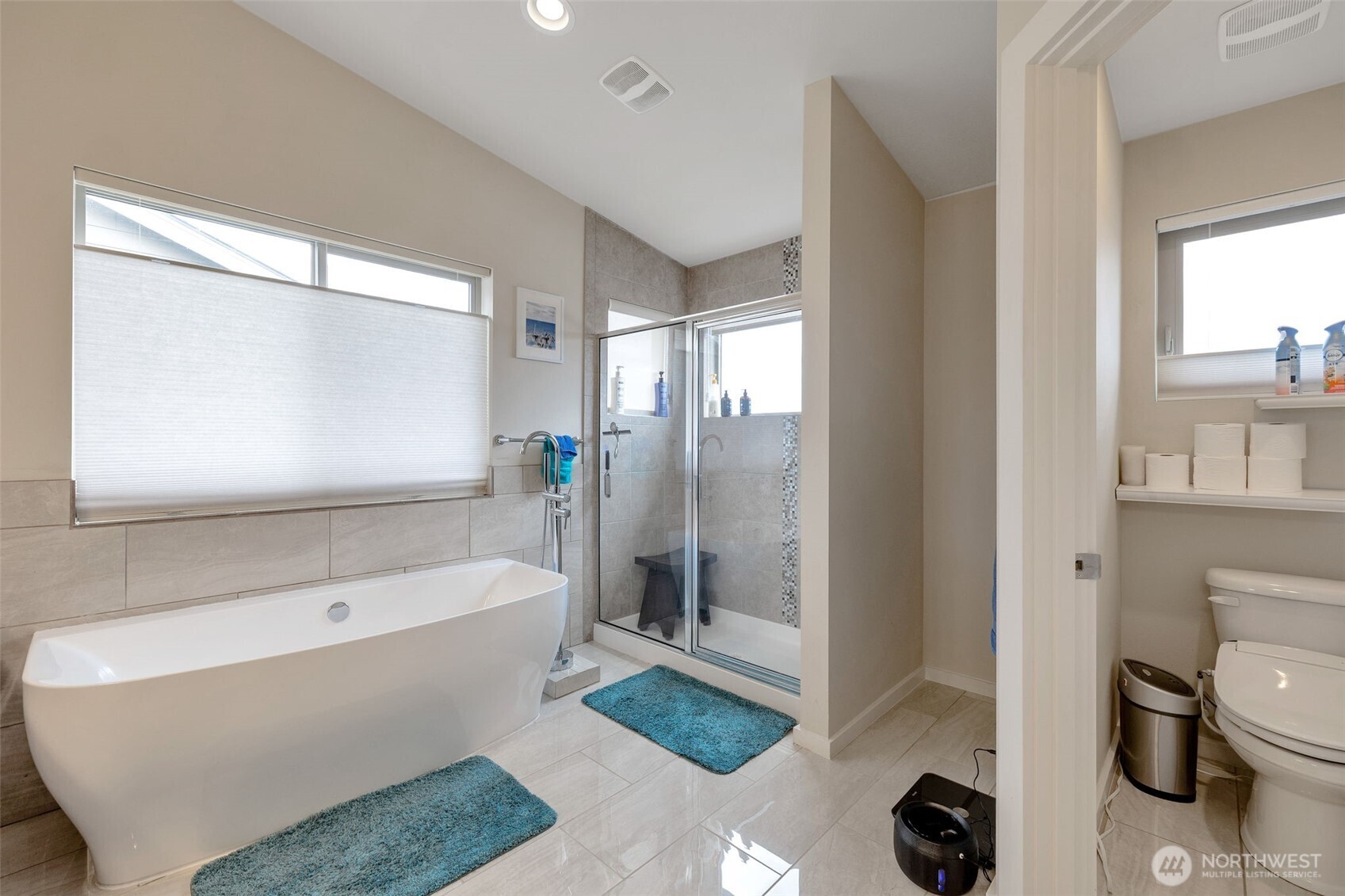 15817 Southeast 252 Place Covington, WA 98042 - Photo 18 of 31 a bathroom with a tub a toilet and a sink