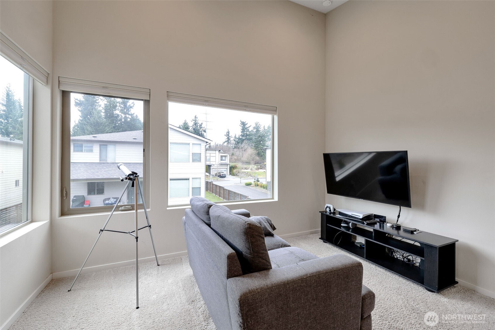 15817 Southeast 252 Place Covington, WA 98042 - Photo 21 of 31 a living room with furniture and a flat screen tv