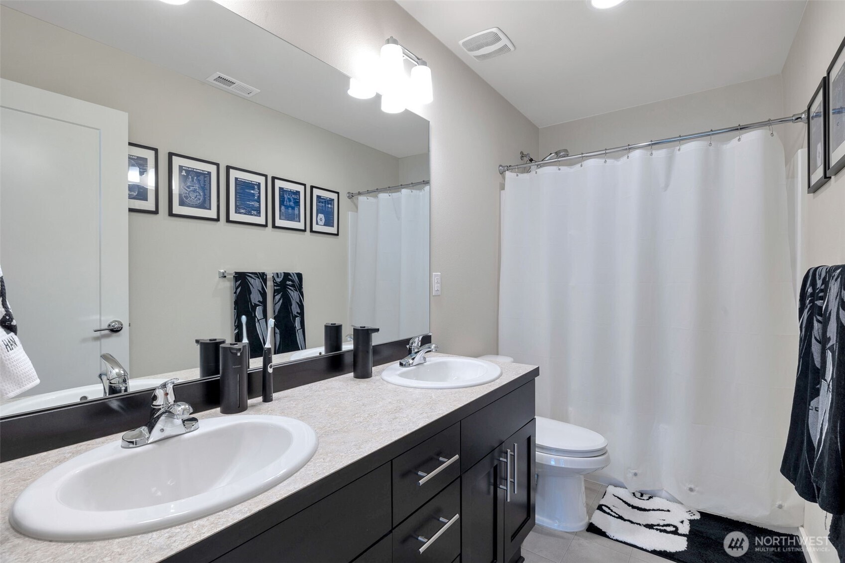 15817 Southeast 252 Place Covington, WA 98042 - Photo 22 of 31 a bathroom with a double vanity sink toilet and a mirror