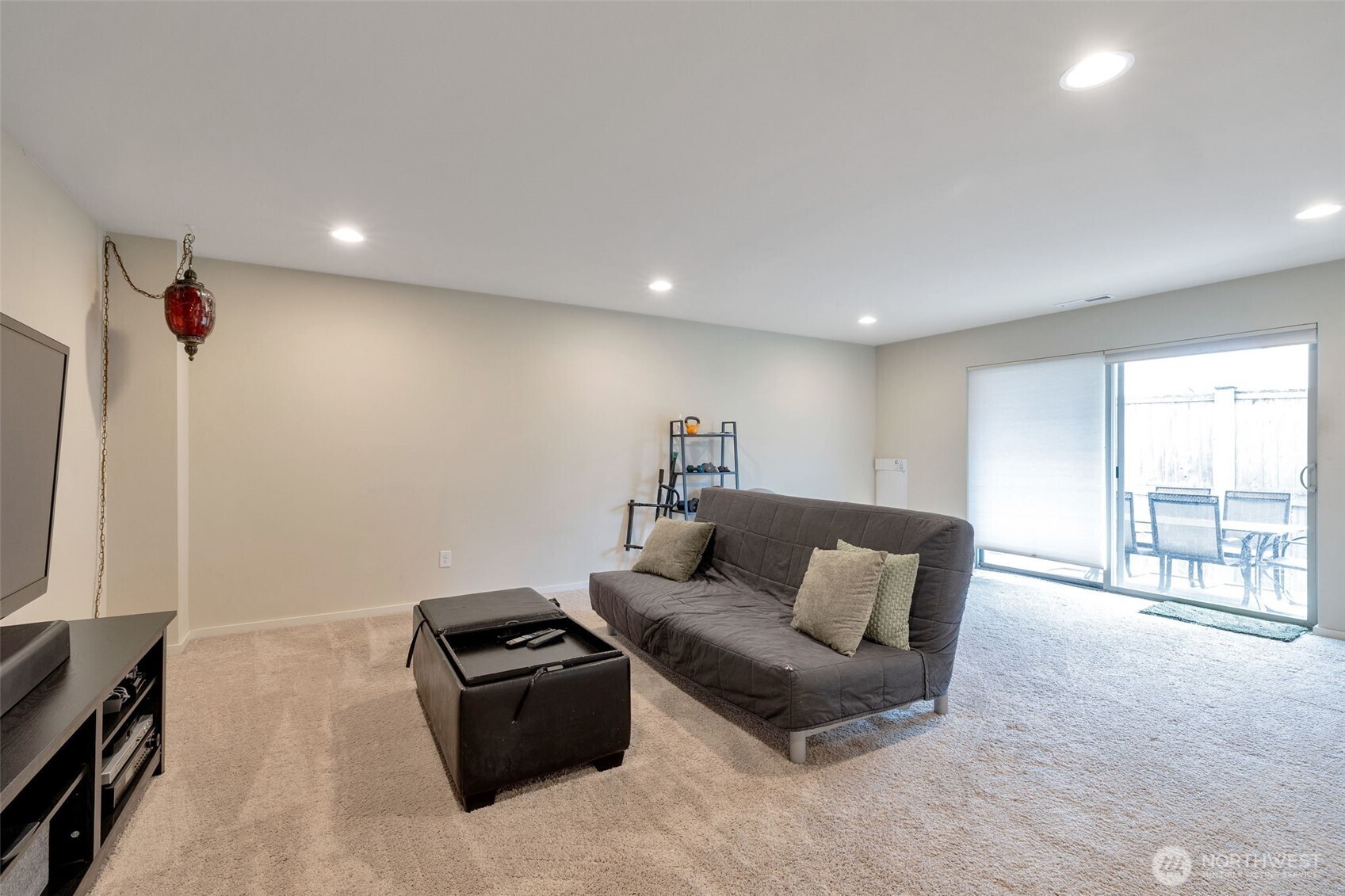 15817 Southeast 252 Place Covington, WA 98042 - Photo 27 of 31 a living room with furniture and a flat screen tv