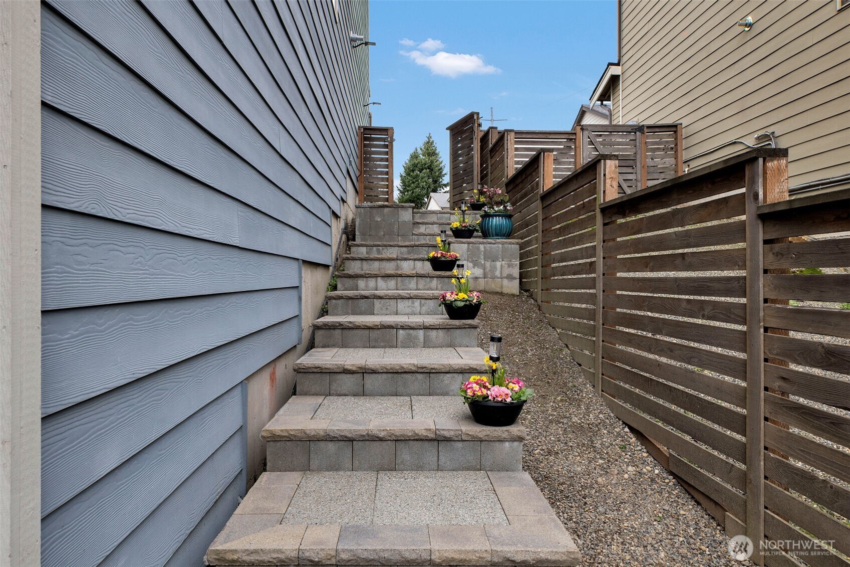 15817 Southeast 252 Place Covington, WA 98042 - Photo 5 of 31 a view of stairs and wooden floor with a fire pit