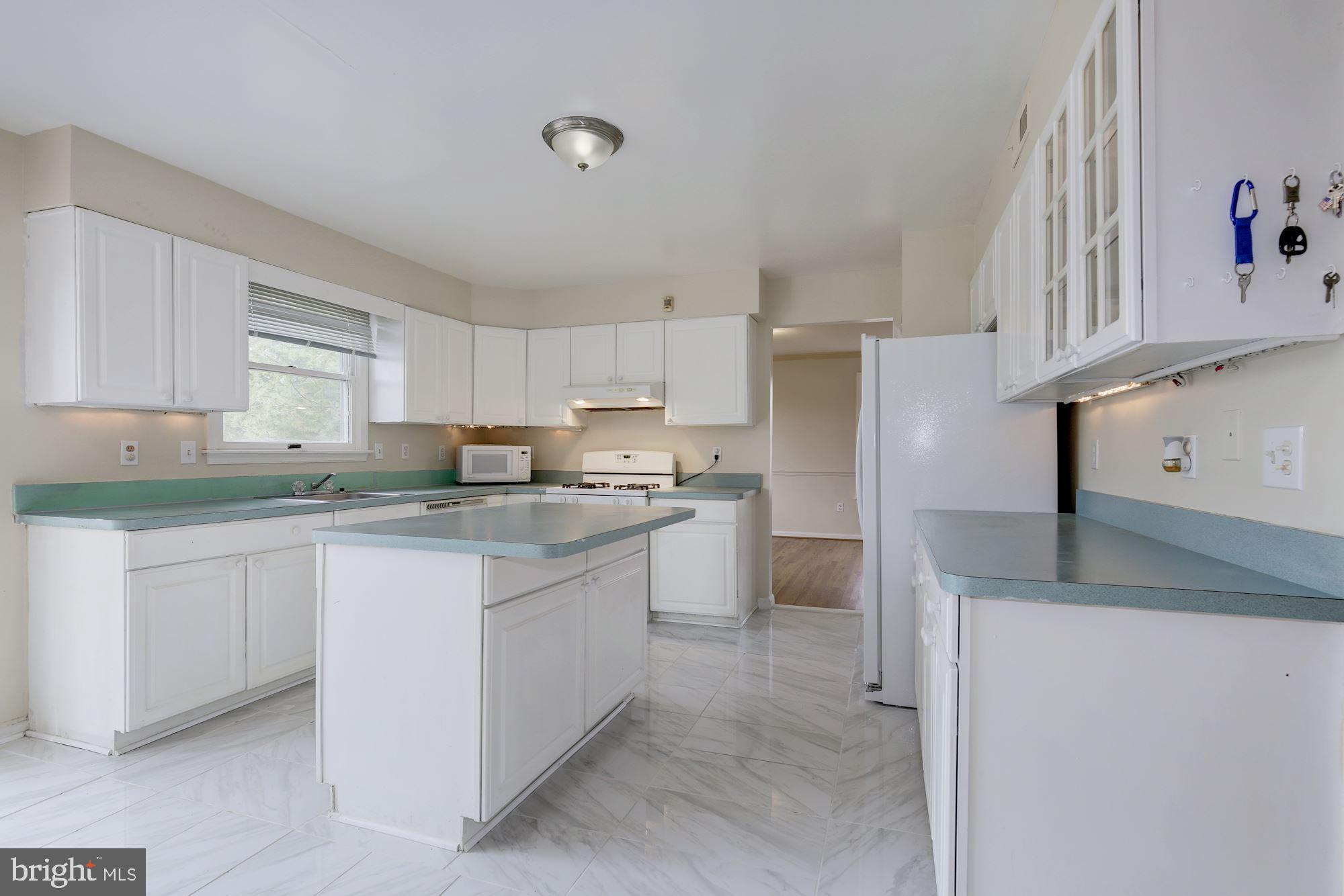 2925 Fairland Road Silver Spring, MD 20904 - Photo 19 of 60 White cabinets on white floors