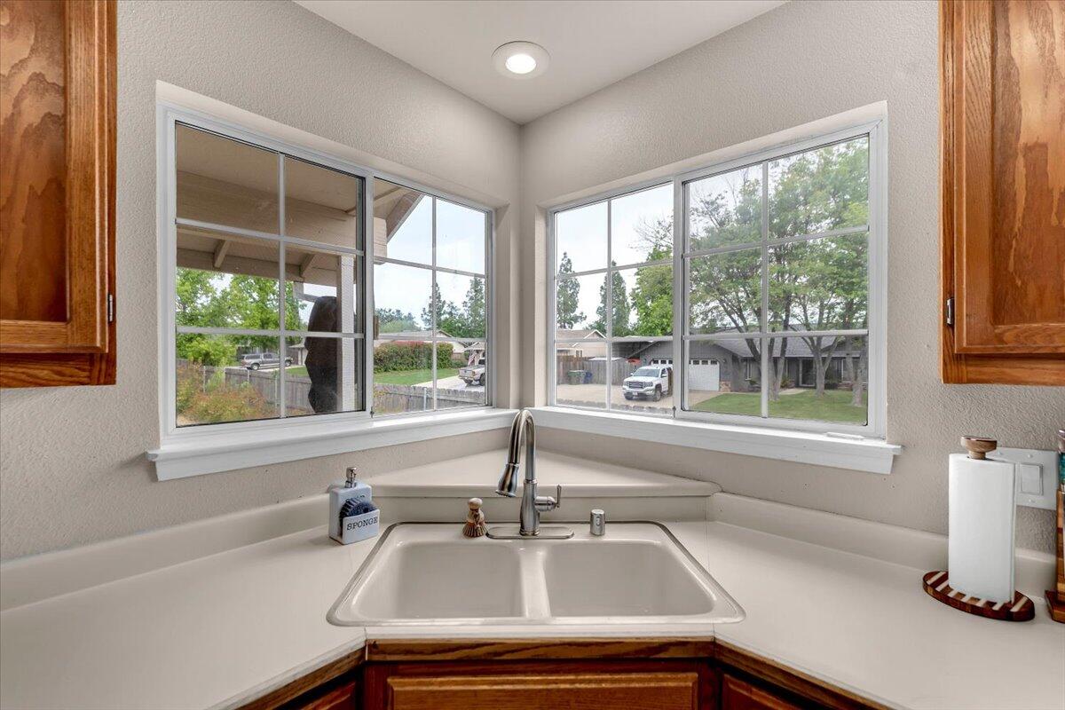 1675 Hominy Way Redding, CA 96003 - Photo 12 of 38 a bathroom with a sink and a large window