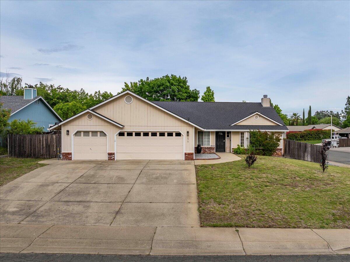 1675 Hominy Way Redding, CA 96003 - Photo 26 of 38 a house view with a garden space