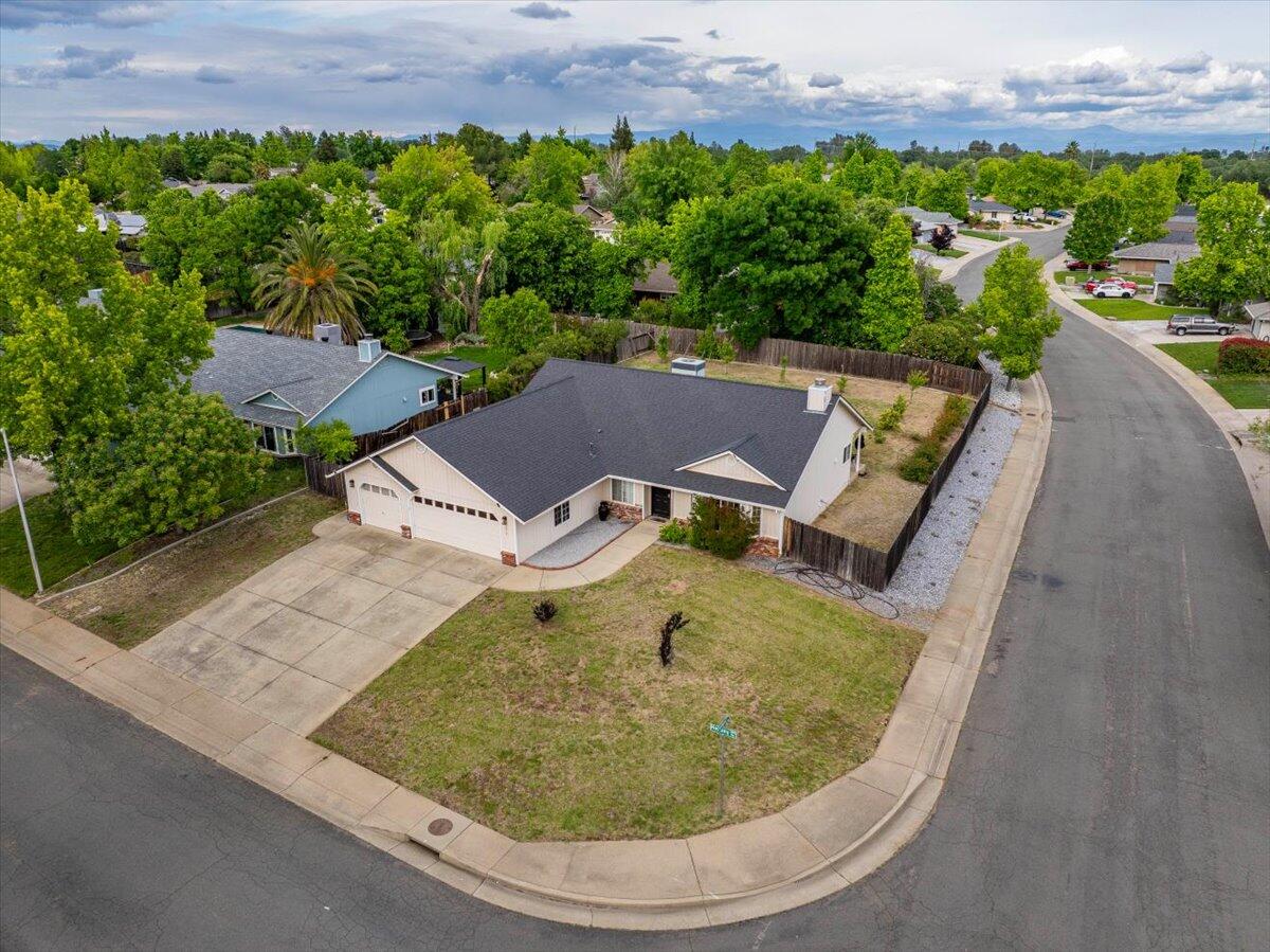 1675 Hominy Way Redding, CA 96003 - Photo 29 of 38 an aerial view of a house with a garden and lake view