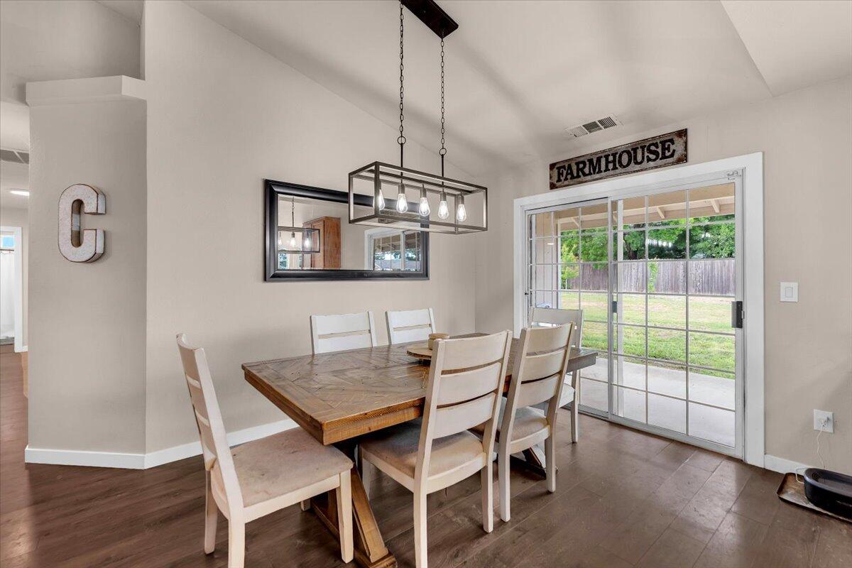 1675 Hominy Way Redding, CA 96003 - Photo 8 of 38 a view of a dining room with furniture window and wooden floor