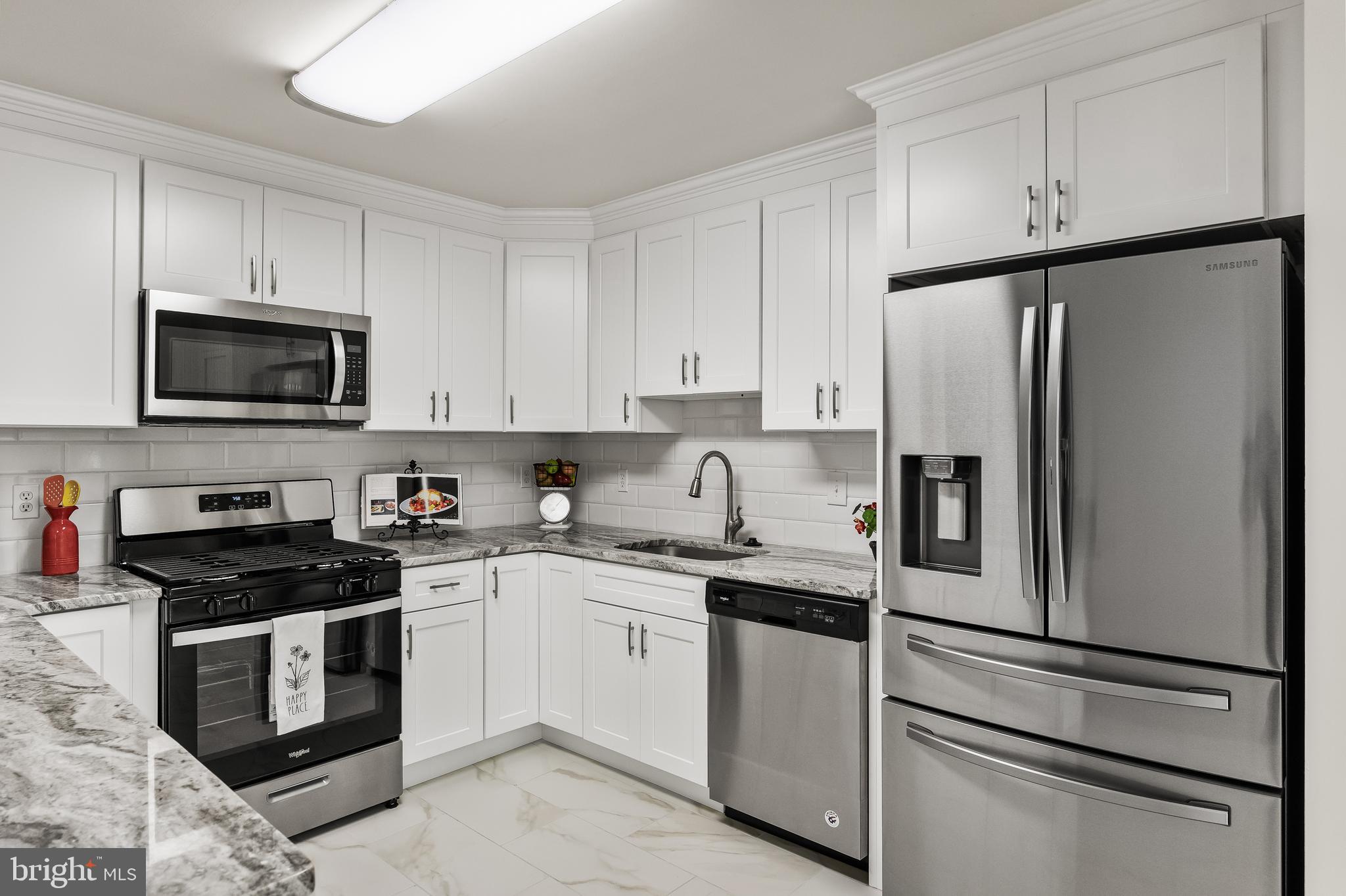 773 Barton Run Boulevard Marlton, NJ 08053 - Photo 14 of 30 a kitchen with cabinets stainless steel appliances and wooden floor
