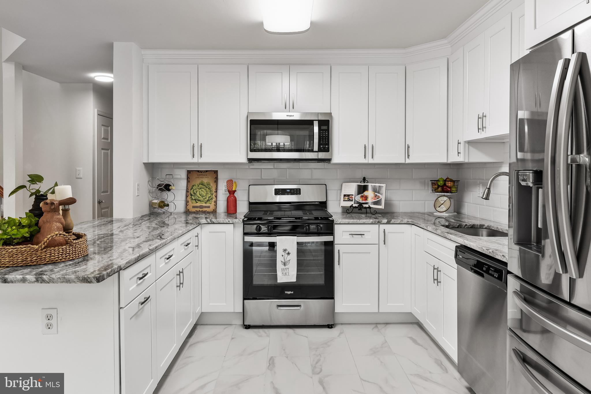 773 Barton Run Boulevard Marlton, NJ 08053 - Photo 15 of 30 a kitchen with stainless steel appliances granite countertop a stove a sink and a refrigerator