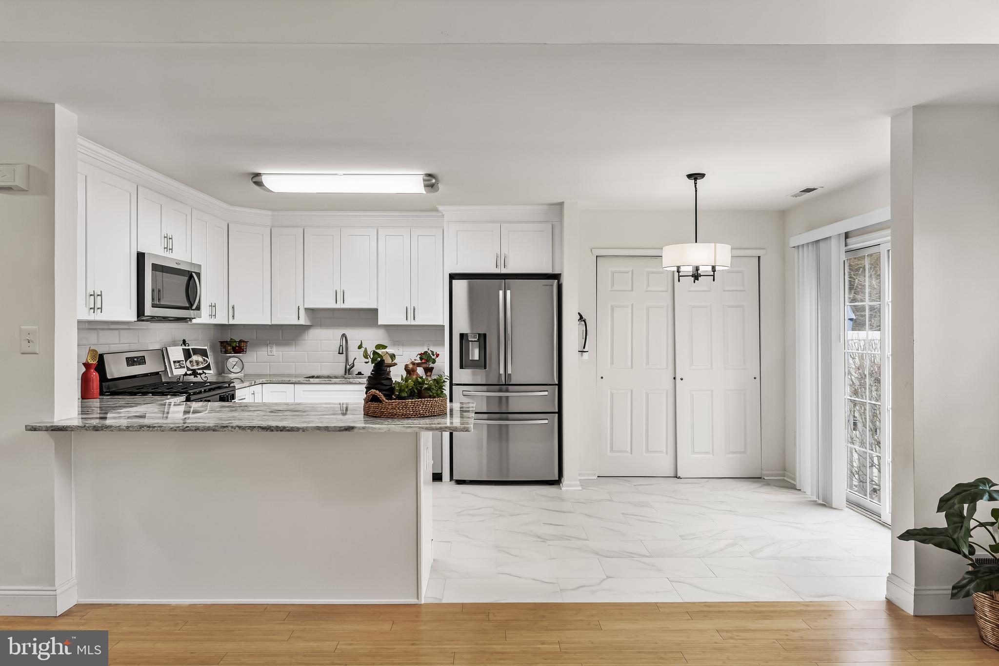 773 Barton Run Boulevard Marlton, NJ 08053 - Photo 17 of 30 a kitchen with stainless steel appliances granite countertop a refrigerator a stove a sink and white cabinets
