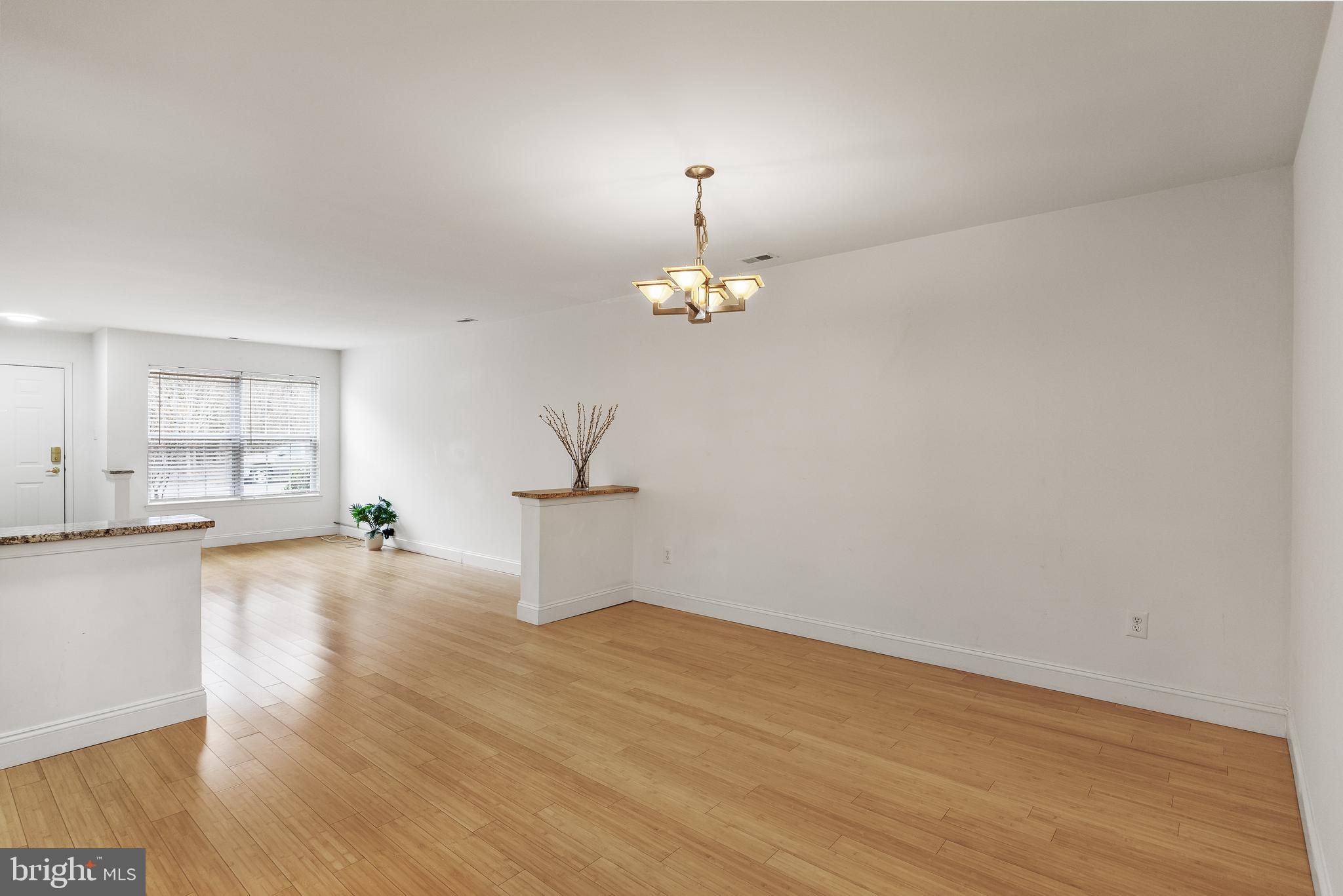 773 Barton Run Boulevard Marlton, NJ 08053 - Photo 8 of 30 a view of a room with wooden floor and a chandelier