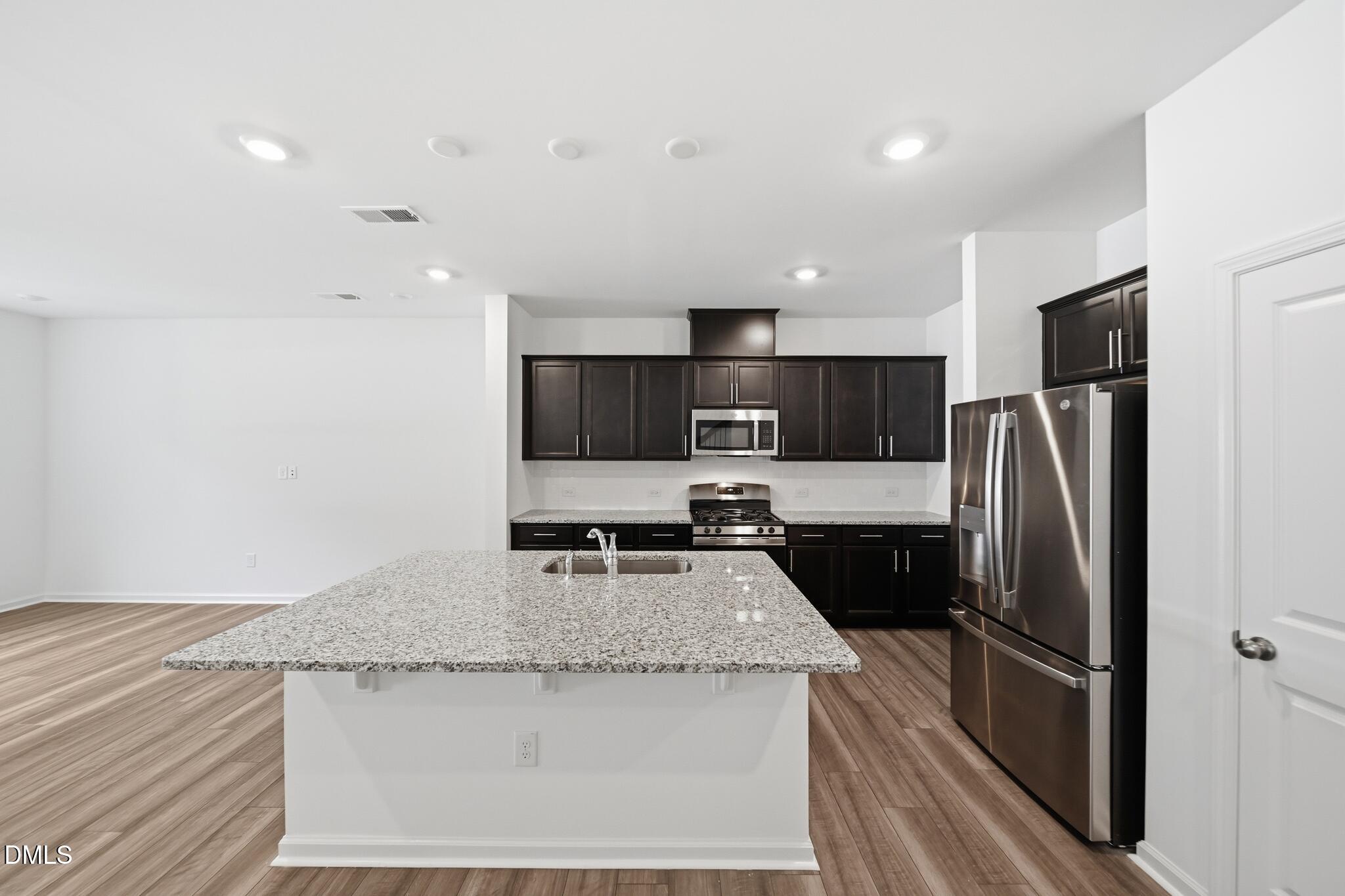 216 Tree Moss Court Rolesville, NC 27571 - Photo 8 of 31 13_216_Tree_Moss_Ct-Kitchen-2077